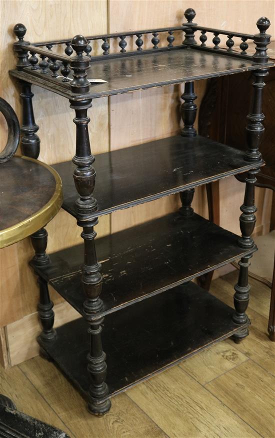 A Victorian ebonised four tier open bookcase w.58cm